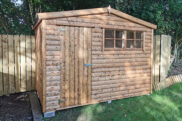 An image of a sturdy garden shed with two windows